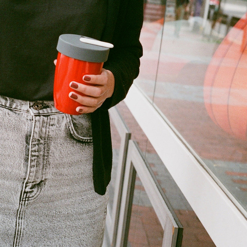 girl holding coffee cup